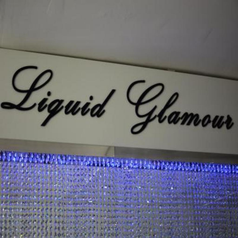 Glamorous signs at sophisticated new Liquid Glamour salon and boutique